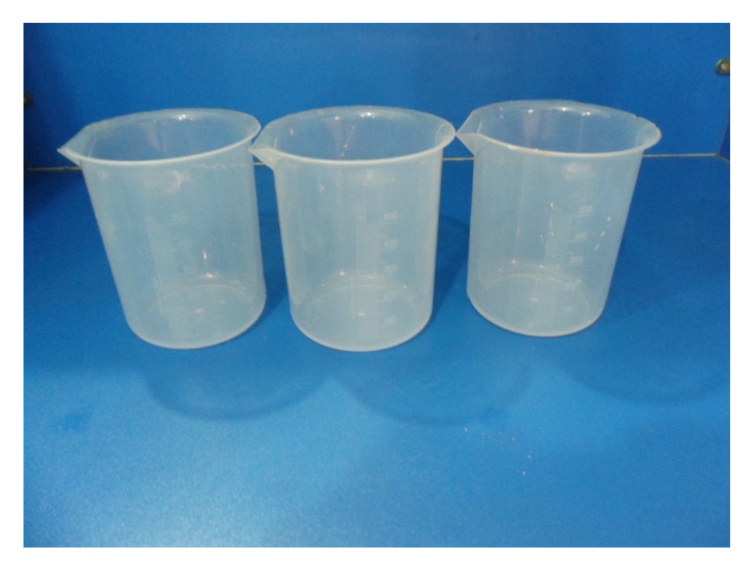 Standard plastic beakers with lip for pouring lab liquids.